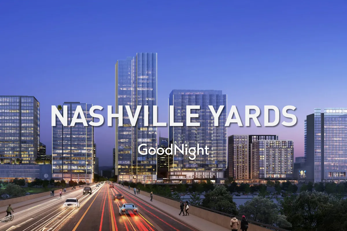 A bustling cityscape with gleaming skyscrapers, city skyline, moving traffic, and pedestrians exploring the energetic urban environment. The view hints at endless possibilities for exploration, from dining out to attending events downtown.